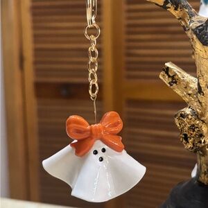 Handmade baked clay car ghost. Can add essential oils under ghost.